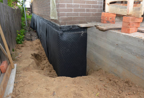 SJ Waterproofing Pros technician performing targeted Foundation Crack Repair assessment in Burlington, NC